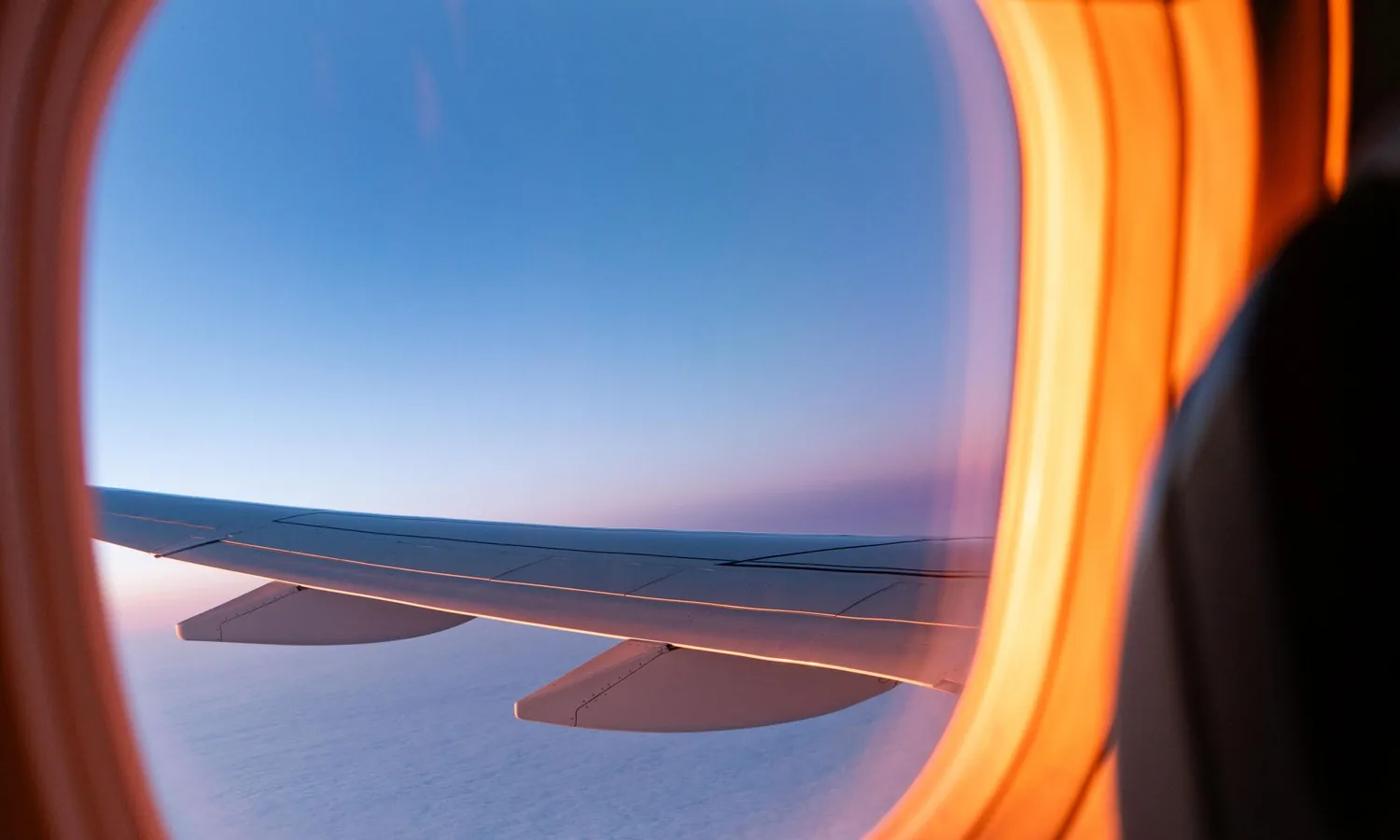 The view through an aeroplane window at sunset
